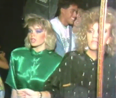 A gif of two ladies dancing in a synchronized way in a club while the camera zooms out a bit A gif of two ladies dancing in a synchronized way in a club while the camera zooms out a bit
