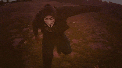 A gif of someone in a guy fawkes mask dancing A gif of someone in a guy fawkes mask dancing